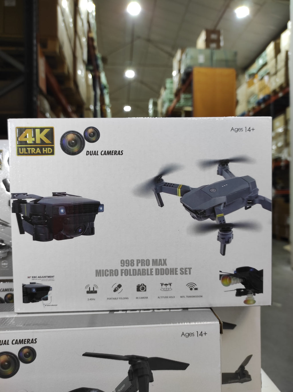 Dron doble cámara 4K en caja, incluye maletín y características de cámaras duales.